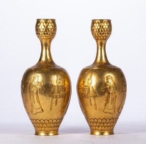 A pair of gilt copper bottles
