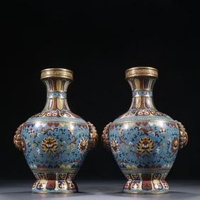 A pair of gilt cloisonné floral lion ear bottles