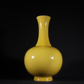 A Qing Dynasty Qianlong yellow glaze appreciation bottle