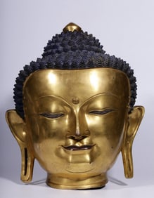 A Qing Dynasty bronze gilt Shakyamuni Buddha head