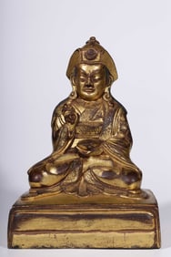 A Qing Dynasty bronze gilt medallion Jiahu Tuketu seated statue