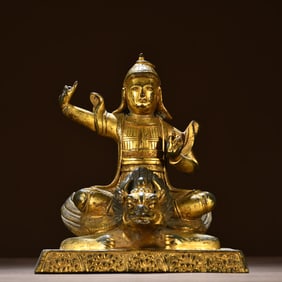 A bronze gilt statue of the Dharma protector