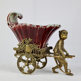 One piece of sacrificial red glaze inlaid bronze monkey cart (fruit basket)