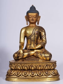 A Qing Dynasty bronze gilt statue of a seated Buddha
