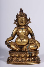A Qing Dynasty bronze gilt inlaid treasure yellow God of Wealth seated statue