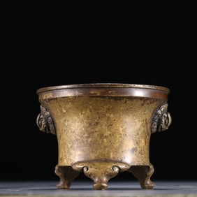 A Xuande model copper fetal beast face ear incense burner