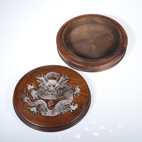 A piece of wood carving with a dragon playing with beads lid box