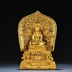 A Tibetan bronze gilt Guru Buddha ornament