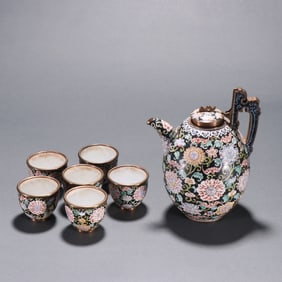 A set of Qing Dynasty teapots with copper black ground enamel floral pattern
