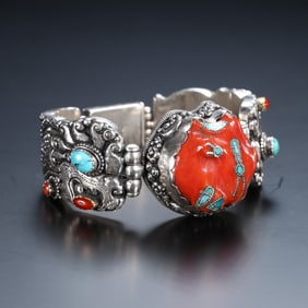 A silver-tired gem-encrusted bracelet