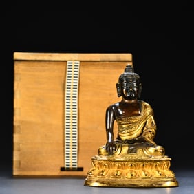 A bronze gilt Buddha ornament