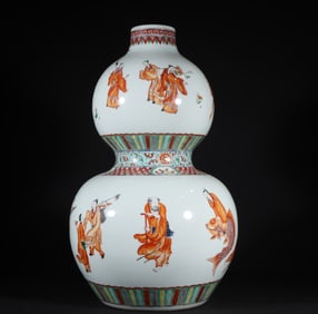 A Qing Dynasty Kangxi alum red group of immortal gourd bottles