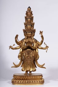 A Qing Dynasty bronze gilt eight-armed, eleven-sided statue of Guanyin
