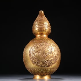 A Tang copper gilt chisel phoenix wearing flowers flying pattern gourd bottle