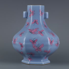 A piece of sky blue glaze and pastel hundred butterfly pattern hexagonal bottle during the Qianlong
