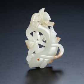 A piece of jade carved lotus year has a fish to wear