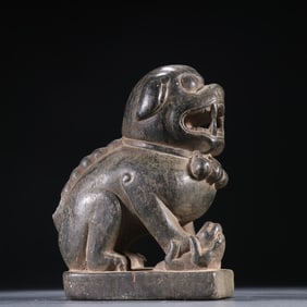 A bluestone lion ornament