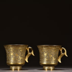 A pair of sterling silver gilt twig flower cups