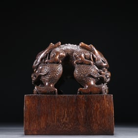 A piece of clear agarwood twisted seal