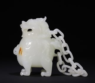 A piece of white jade is incensed