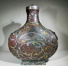 An old silverware dragon and phoenix pattern phoenix head bottle