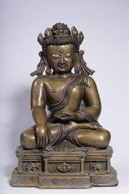 A Qing Dynasty two-color alloy copper wrong silver immovable Buddha sitting statue