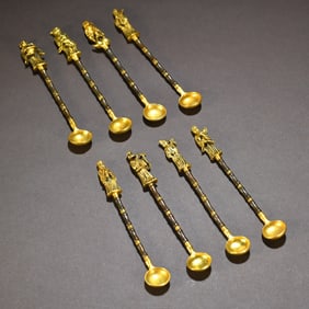 A set of copper-gilt Eight Immortal spoons