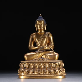 A Qing Dynasty bronze gilt seated statue of Shakyamuni Buddha