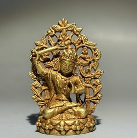 A pure gold statue of Manjushri Buddha