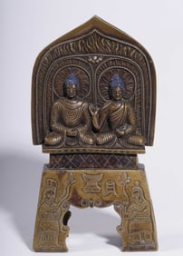 A Qing Dynasty alloy bronze double Buddha seated side by side