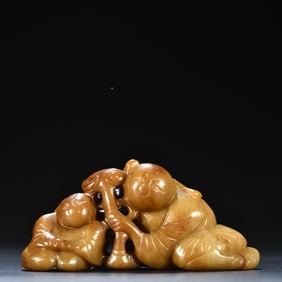 An old Hetian jade Ruyi boy carving