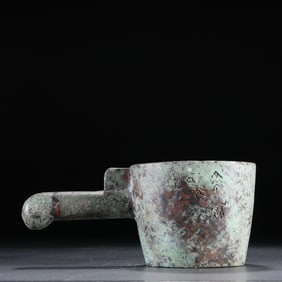 A piece of bronze with an inscription iron