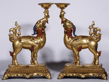 A pair of Qing Dynasty bronze gilt auspicious ruyi ornaments