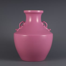 A piece of Qing Qianlong year made rouge powder glaze Ruyi ear bottle