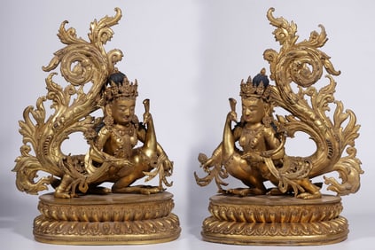 A pair of bronze gilt peacock statues of the Qing Dynasty