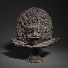A bronze gilt Tibetan oil lamp study ornament