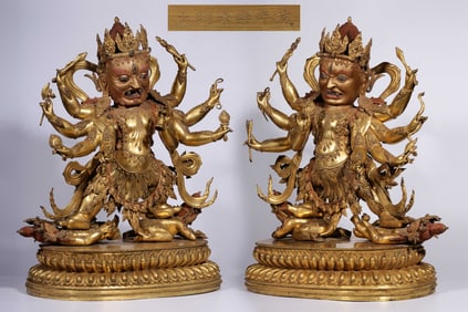 A pair of Ming Dynasty "Ming Yongle Nianshi" bronze gilt eight-armed King Kong statues