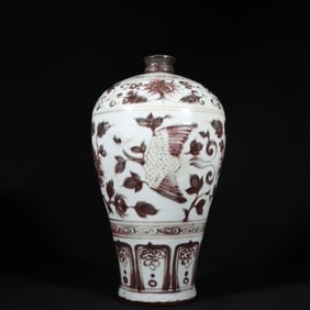 A Ming Dynasty glaze red phoenix wearing a floral plum vase