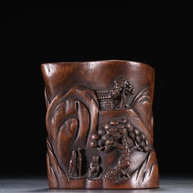 A late Qing Dynasty agarwood carved mountain stone figure pen holder