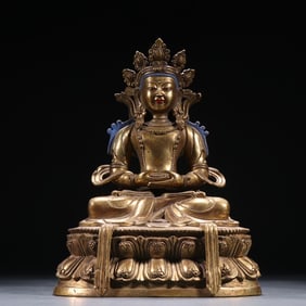 A bronze gilt statue of the Buddha of Longevity from the Qing Dynasty