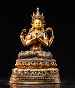 A piece of copper gilt filigree inlaid with gemstones four-armed Guanyin