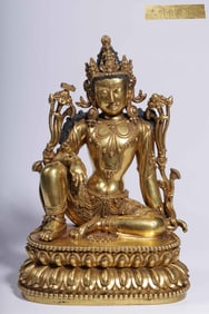 A Ming Dynasty "Ming Yongle New Year" bronze gilt Guanyin sitting statue
