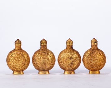 A set of copper-gilt snuff bottles