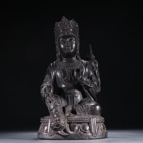 A Qing Dynasty black stone statue of Tara