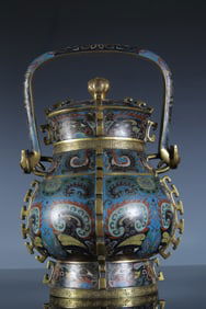 A piece of copper gilt cloisonne gluttonous pattern handle