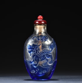 A piece of clear glazed carved unicorn snuff bottle