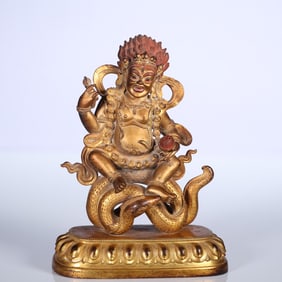 A bronze gilt statue of the Dharma Protector