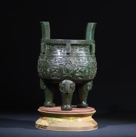 A jasper beast face halberd round tripod ornament