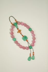 A piece of pink tourmaline eighteen hands a placket