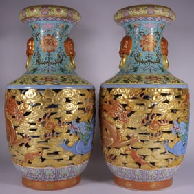 A pair of Qianlong enamel green carved gold double dragon play beads hollow lion ear bottle